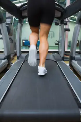 Legs running on a treadmill