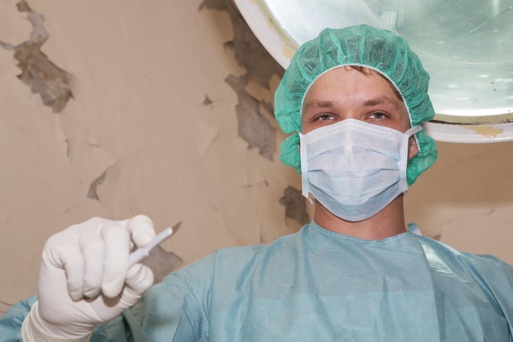 Surgeon have sadistic look before coming surgery