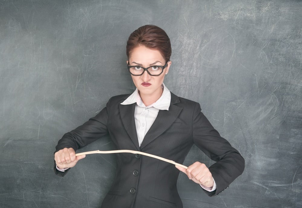 Angry teacher with wooden stick