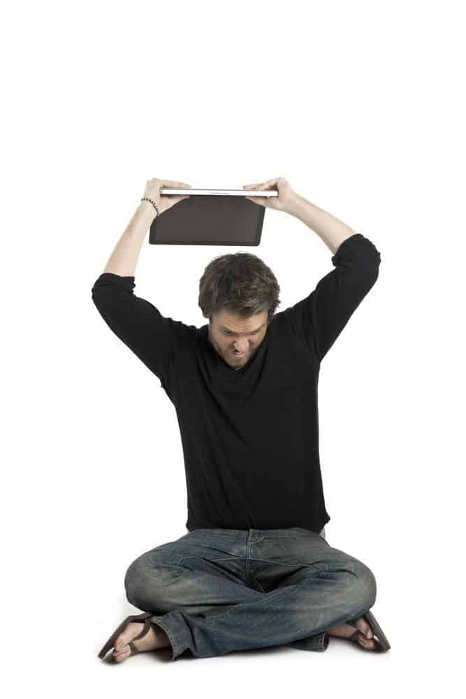 a man about to throw his laptop