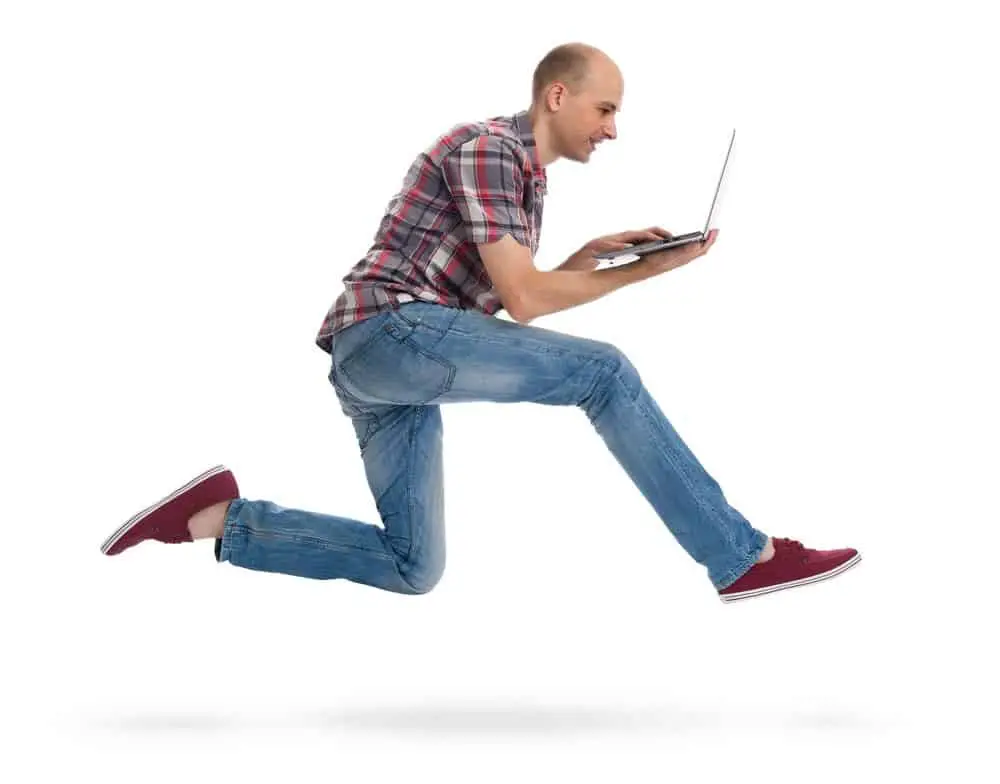 man running with a laptop isolated on white background