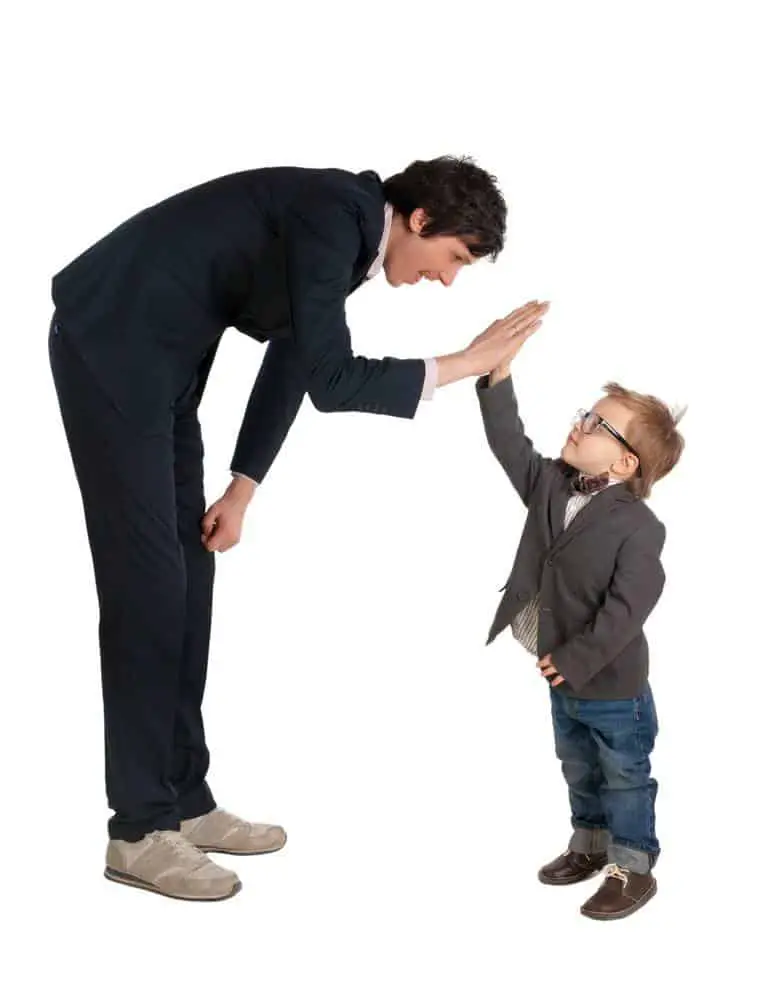 Man and little boy shake hands isolated on the white